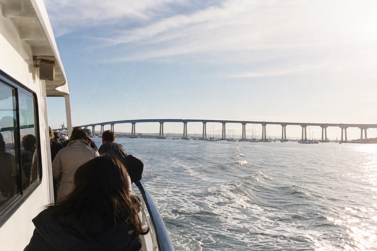 Passenger ferry crossing San Diego Bay toward Coronado with the downtown skyline in the background