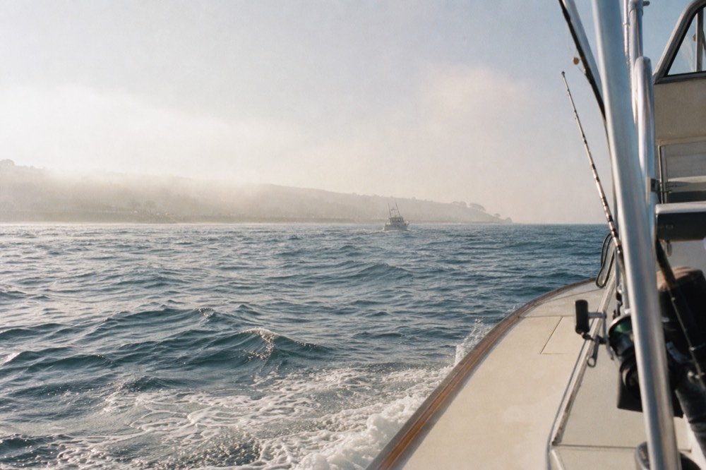 Morning mist and afternoon glare over open water off San Diego, late-morning light