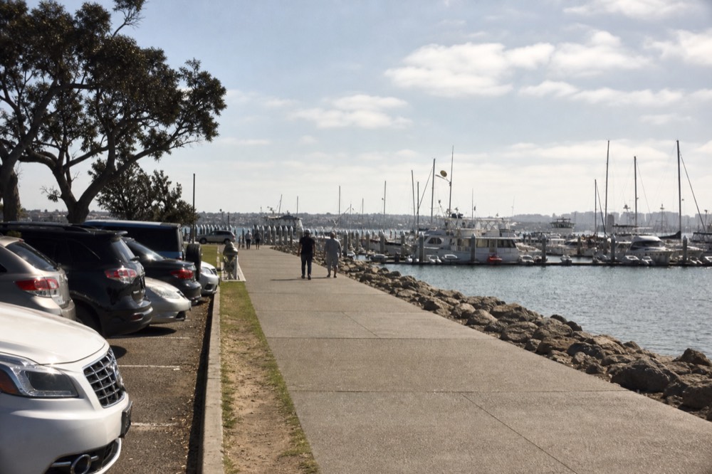 Waterfront parking and the walk toward San Diego's boat piers, late-morning light