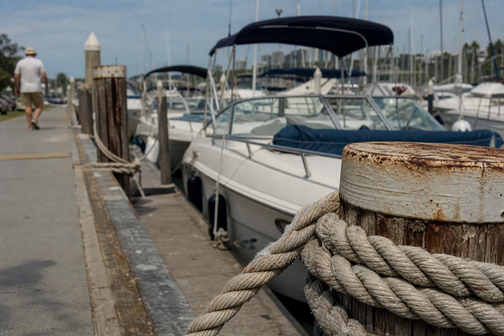 San Diego's boat departure docks and waterfront promenade, shallow depth of field, textures sharp