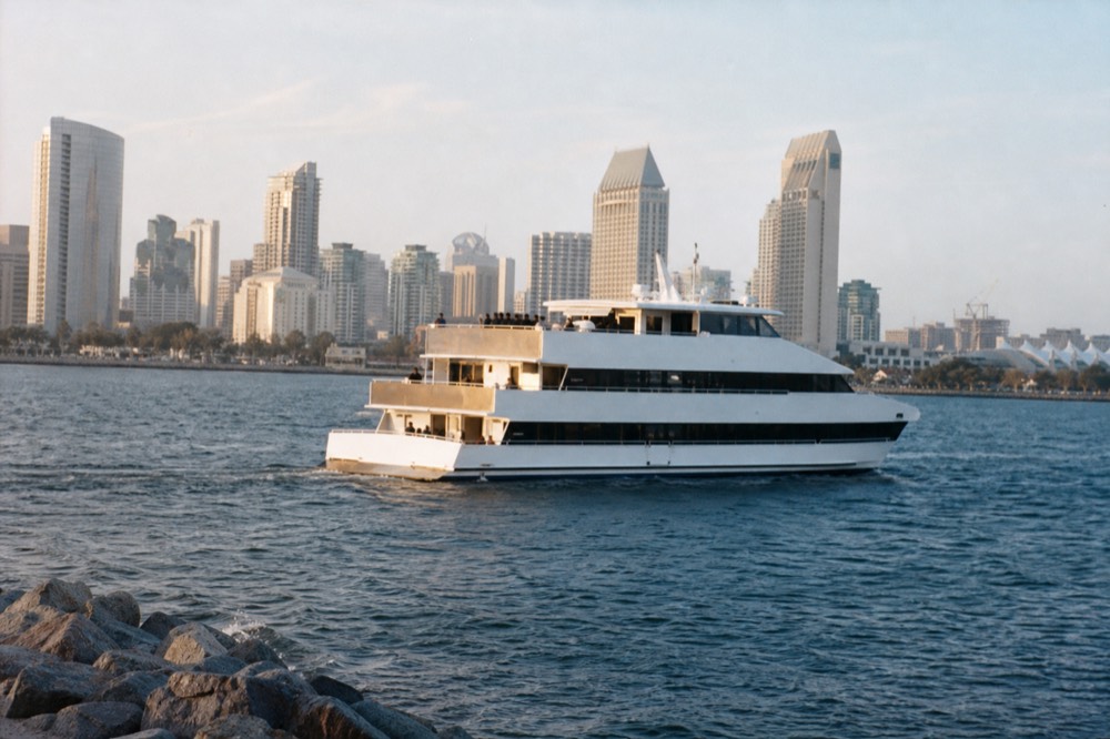 An evening dinner cruise ship on San Diego Bay, late-morning light