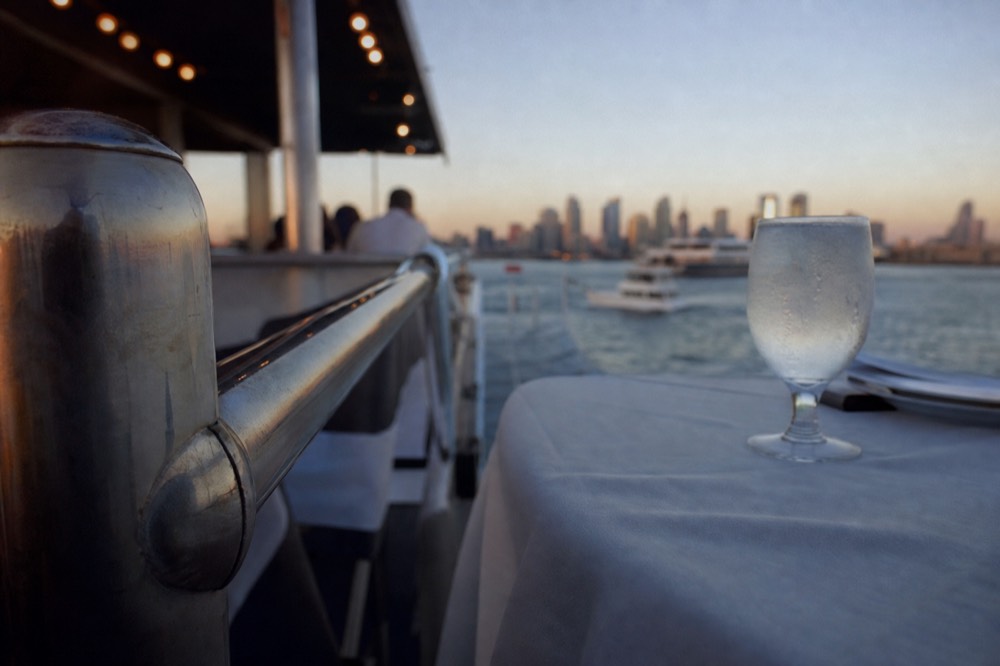 An evening dinner cruise ship on San Diego Bay, shallow depth of field, textures sharp