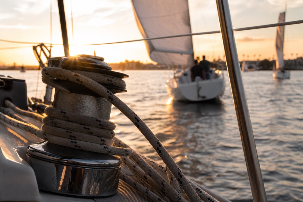 Sunset light over San Diego Bay and its sailboats, shallow depth of field, textures sharp